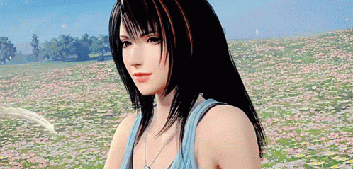 A Woman Is Standing In A Field Of Flowers . GIF