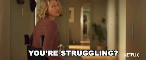 A Woman Is Standing In A Hallway And Says You 'Re Struggling GIF