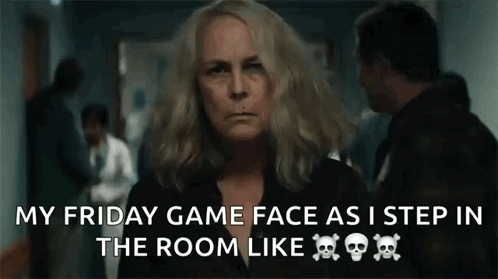 A Woman Is Standing In A Hallway With A Skull And Crossbones On Her Shirt . GIF