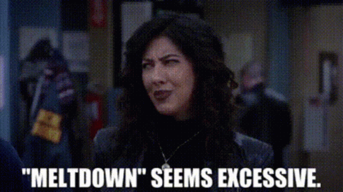 A Woman Is Standing In A Hallway With The Words `` Meltdown '' Seems Excessive Written Below Her . GIF