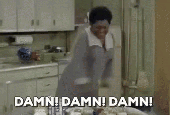 A Woman Is Standing In A Kitchen With The Words `` Damn ! Damn ! Damn ! '' . GIF