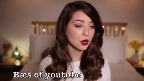 Woman Standing In Front Of Bed With Baes Of YouTube GIF
