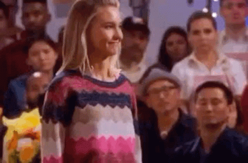 Woman Standing In Front Of Crowd GIF