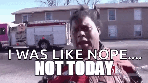 A Woman Is Standing In Front Of A Fire Truck With The Words `` I Was Like Nope ... Not Today '' Written On It . GIF