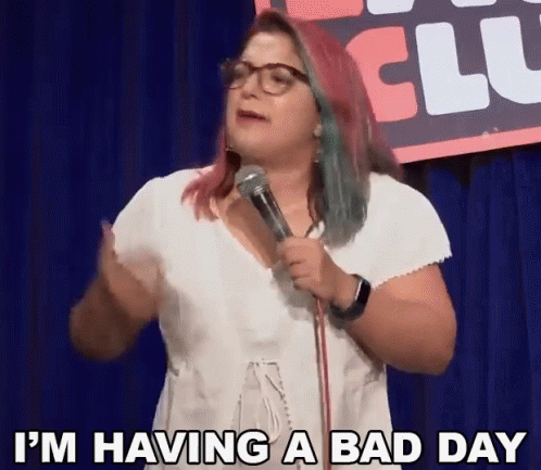 Woman Standing In Front Of Microphone Saying Bad Day GIF