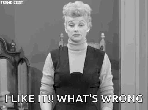 A Woman Is Standing In Front Of A Mirror And Saying `` I Like It What 'S Wrong '' . GIF