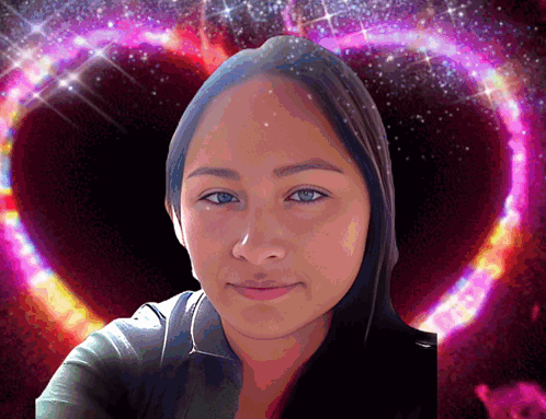 A Woman Is Standing In Front Of A Pink Heart Shaped Background GIF