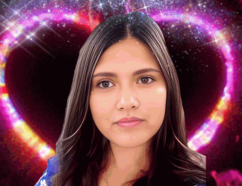 A Woman Is Standing In Front Of A Pink Heart Shaped Background GIF