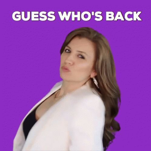 A Woman Is Standing In Front Of A Purple Background With The Words " Guess Who 'S Back " GIF