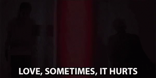 Woman Standing In Front Of Red Light Love Sometimes Hurts GIF