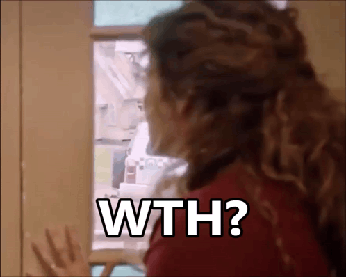 a woman is standing in front of a refrigerator door and asking why ?