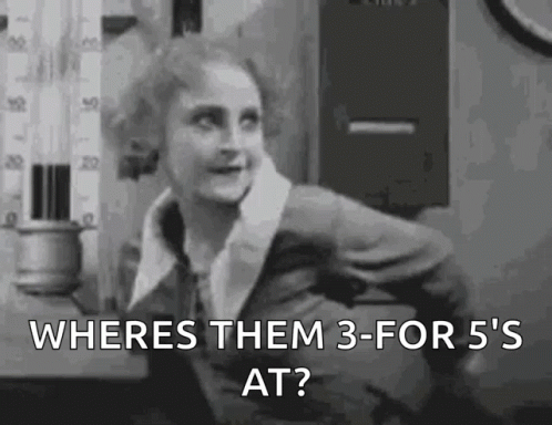 A Woman Is Standing In Front Of A Thermometer In A Black And White Photo . GIF