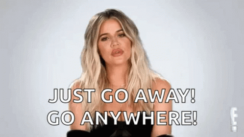 A Woman Is Standing In Front Of A White Background And Saying `` Just Go Away ! Go Anywhere ! '' GIF