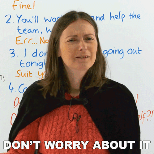 A Woman Is Standing In Front Of A White Board And Says " Don T Worry About It " GIF