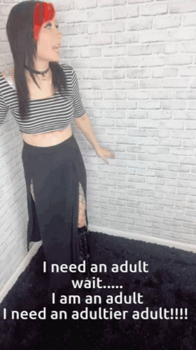 A Woman Is Standing In Front Of A White Brick Wall And Says I Need An Adult GIF