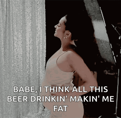 A Woman Is Standing In Front Of A White Curtain And Says " Babe I Think All This Beer Drinkin Makin ' Me Fat " GIF