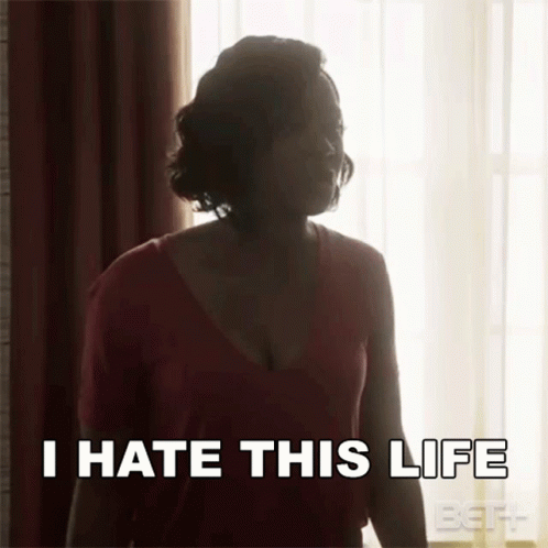 A Woman Is Standing In Front Of A Window With The Words `` I Hate This Life '' Written On Her Face . GIF