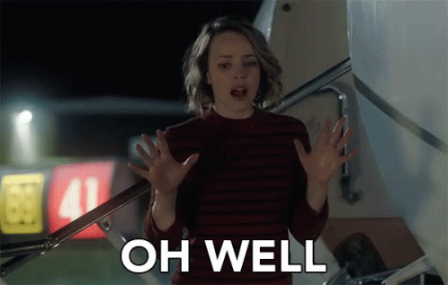 A Woman Is Standing In Front Of An Airplane With Her Hands Outstretched And The Words Oh Well Above Her GIF