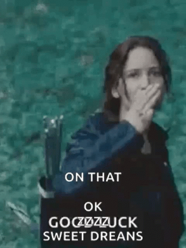 A Woman Is Standing In The Water With Her Hand Up In The Air . GIF