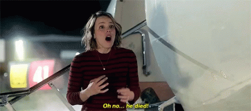 A Woman Is Standing Next To A Plane And Talking To It . GIF