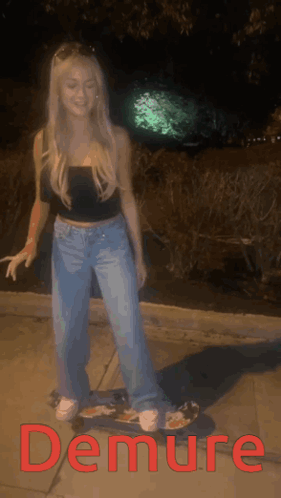A Woman Is Standing On A Skateboard With The Word Demure In Red Letters GIF