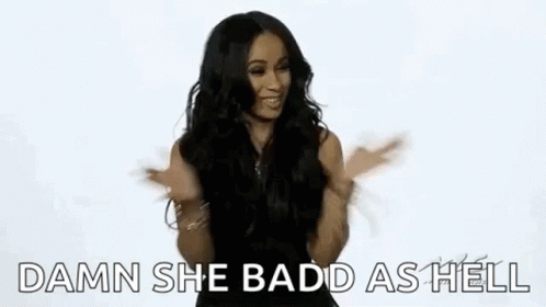 A Woman Is Sticking Her Tongue Out While Dancing And Making A Funny Face . GIF