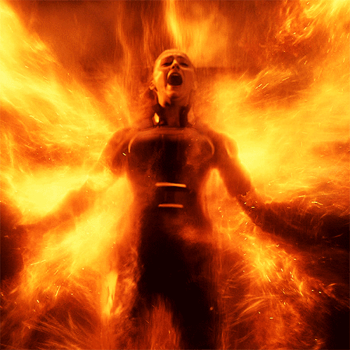 A Woman Is Surrounded By Flames With Her Mouth Wide Open GIF