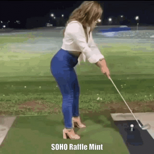 A Woman Is Swinging A Golf Club On A Golf Course With The Caption Soho Raffle Mint . GIF