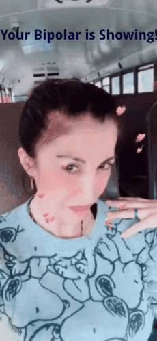 A Woman Is Taking A Picture Of Herself On A Bus With The Words " Your Bipolar Is Showing " On The Bottom GIF