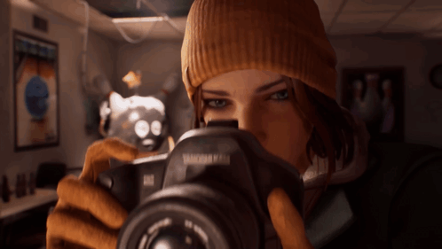 A Woman Is Taking A Picture With A Camera That Says Tamron On It GIF