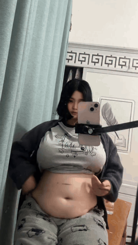 Woman Taking Mirror Selfie With Chinese Writing GIF