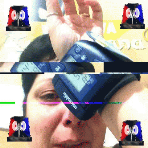 A Woman Is Taking Her Blood Pressure With A Microlife Device On Her Wrist GIF