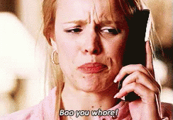 A Woman Is Talking On A Cell Phone And Says Boo You Whore ! GIF