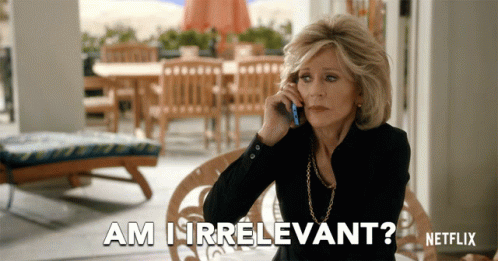 A Woman Is Talking On A Cell Phone And The Words Am I Irrelevant Are Above Her GIF