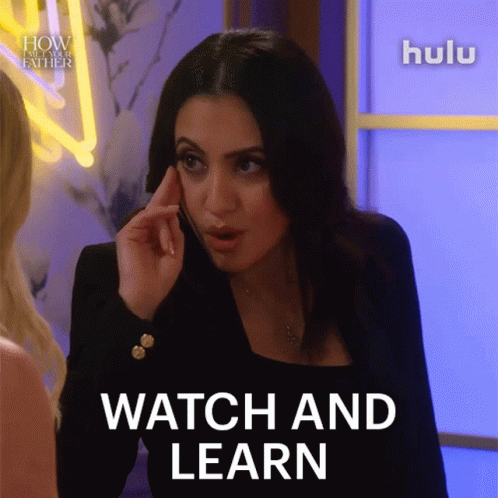 A Woman Is Talking On A Cell Phone And The Words Watch And Learn Are On The Screen GIF