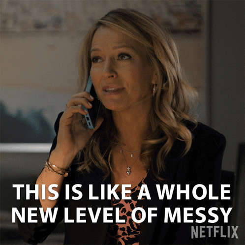 A Woman Is Talking On A Cell Phone With The Caption " This Is Like A Whole New Level Of Messy " GIF