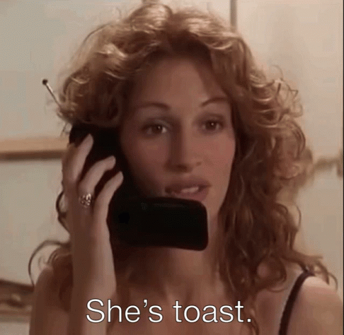 A Woman Is Talking On A Cell Phone With The Words She 'S Toast Written Below Her GIF
