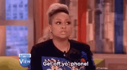 A Woman Is Talking On A Television Show And Saying `` Get Off Yo ' Phone ! '' GIF