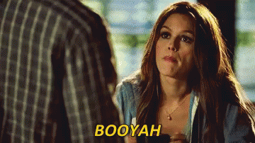 A Woman Is Talking To A Man And The Word Booyah Is Visible GIF