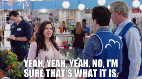 A Woman Is Talking To A Man In A Store While A Man In A Blue Vest Says Yeah GIF