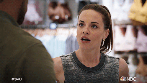 A Woman Is Talking To A Man In A Store With The Hashtag #Svu GIF