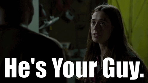 A Woman Is Talking To A Man With The Words He 'S Your Guy GIF
