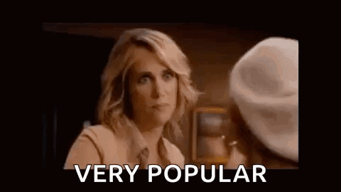 A Woman Is Talking To Another Woman And Making A Funny Face . GIF