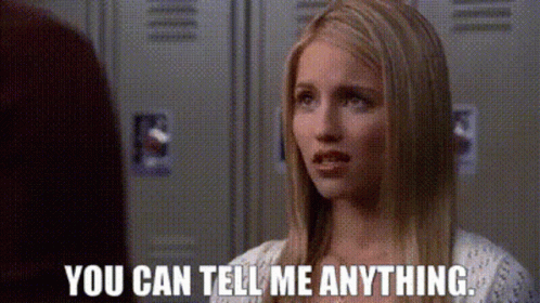 A Woman Is Talking To Another Woman In Front Of Lockers And Says `` You Can Tell Me Anything . '' GIF