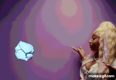 a woman is throwing a ball in the air .