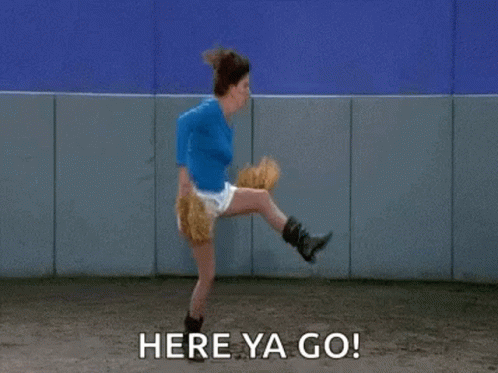 A Woman Is Throwing A Baseball With The Words `` Here Ya Go '' Written Next To Her . GIF