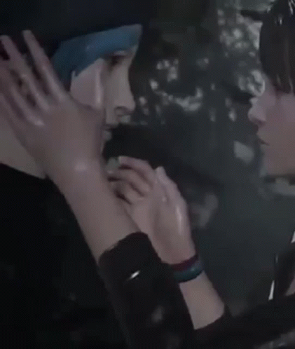 A Woman Is Touching A Man 'S Face With Her Hand . GIF