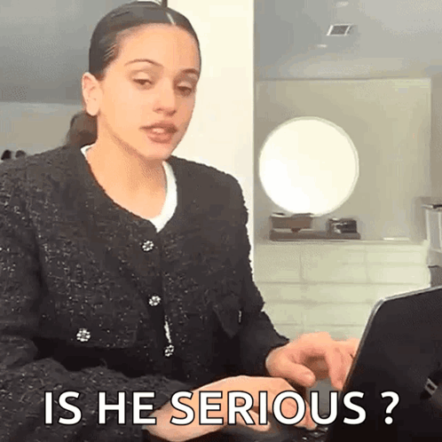 A Woman Is Typing On A Laptop Computer And Asking Is He Serious ? GIF