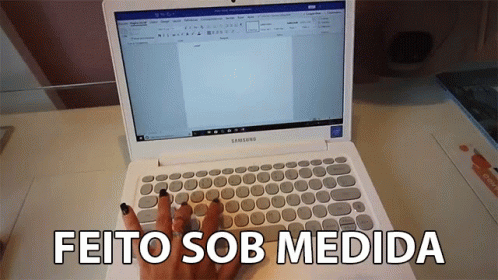 A Woman Is Typing On A White Samsung Laptop With The Words Feito Sob Medida Below It GIF