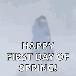 A Woman Is Walking In The Snow With The Words Happy First Day Of Spring GIF